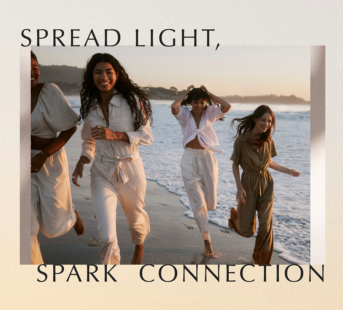Spread Light, Spark connection text - photo of models on the beach