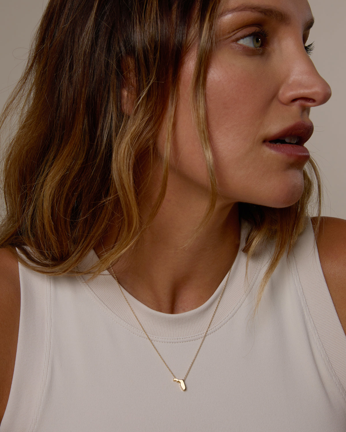 Model wearing In The Heart Of Necklace in gold