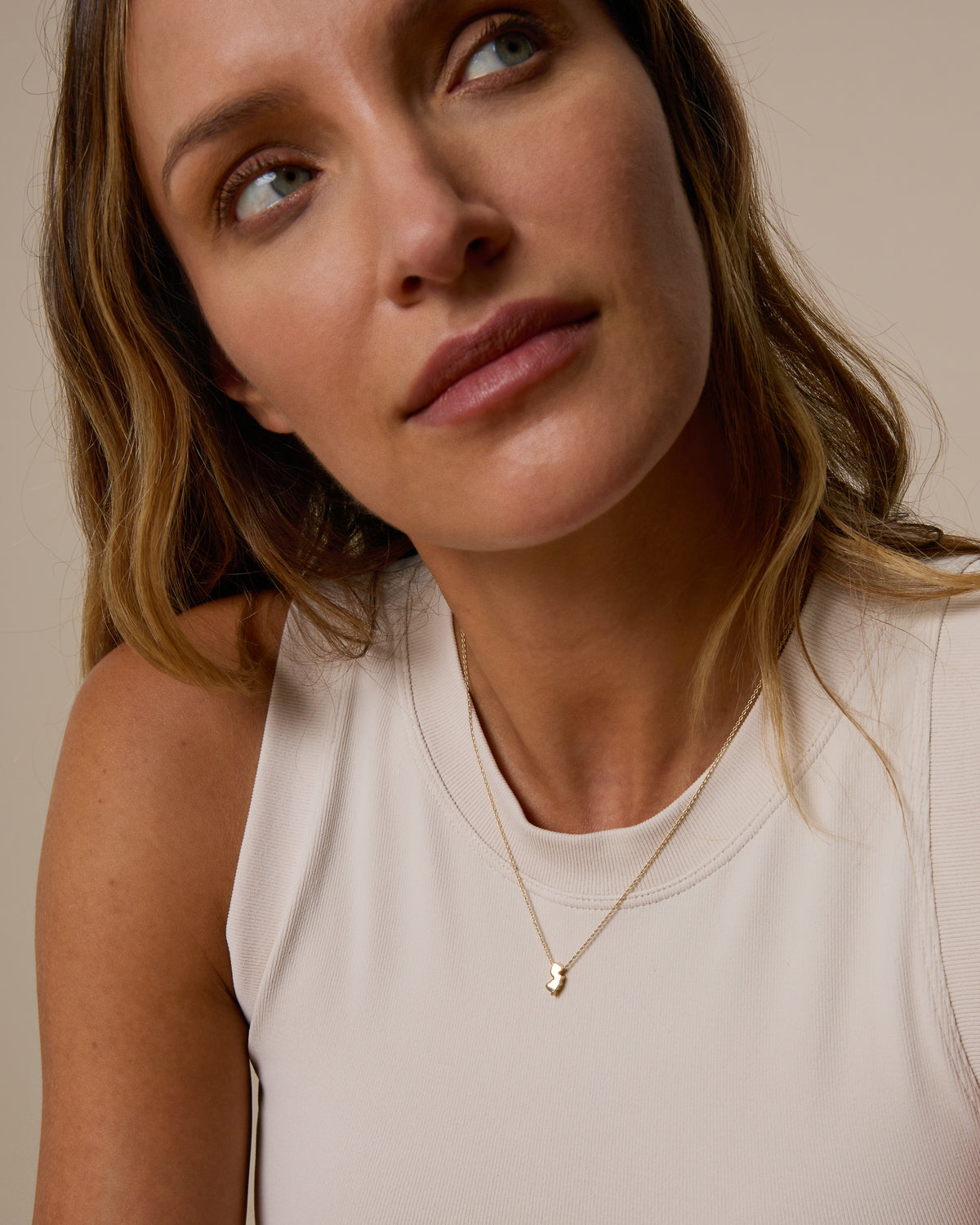 Model wearing In The Heart Of Necklace in gold