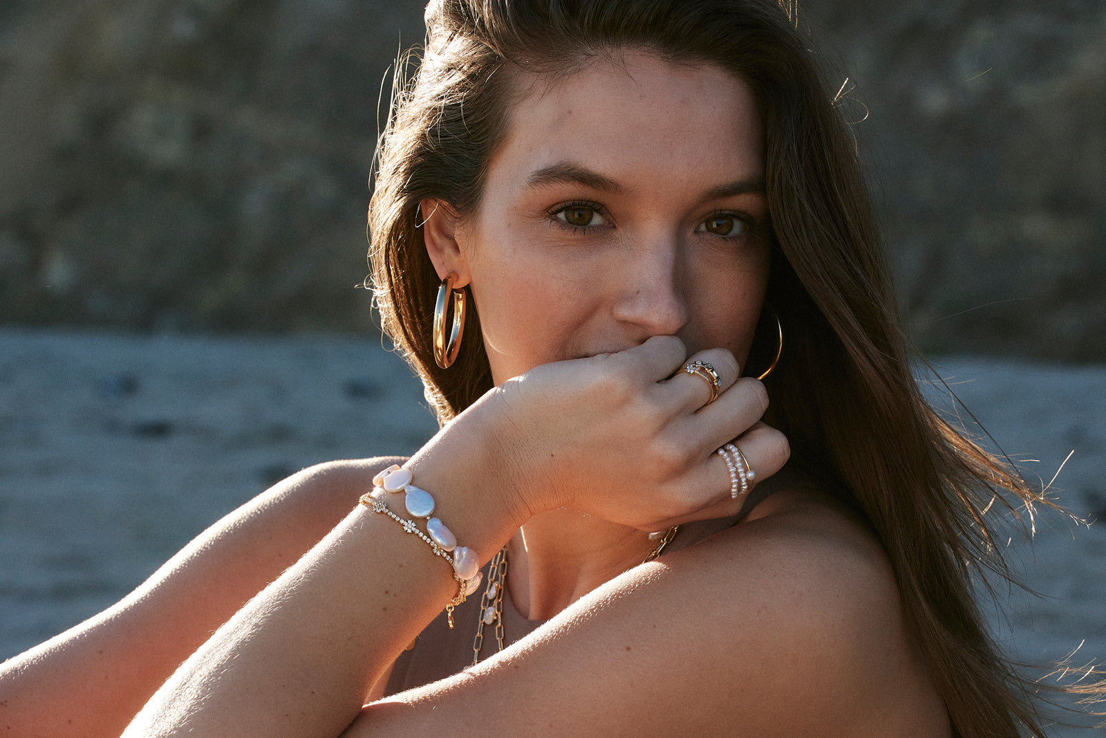 Model wearing Baroque Pearls bracelet and rings