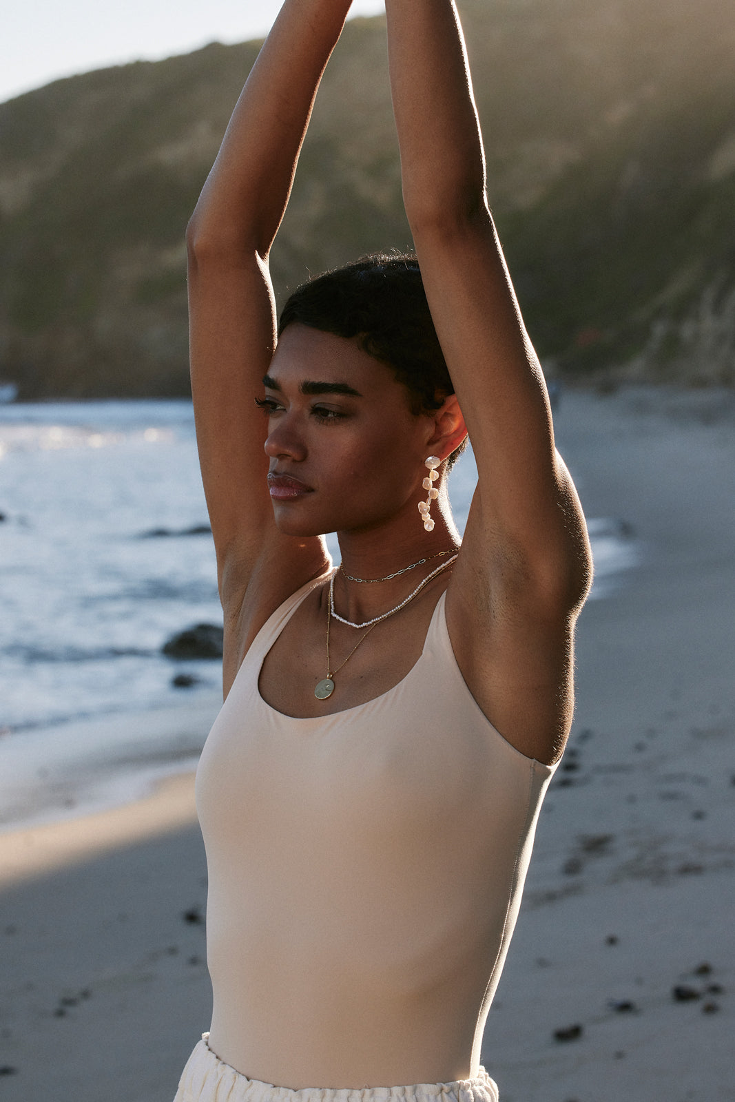 Model on the beach wearing Bryan Anthonys grit necklace
