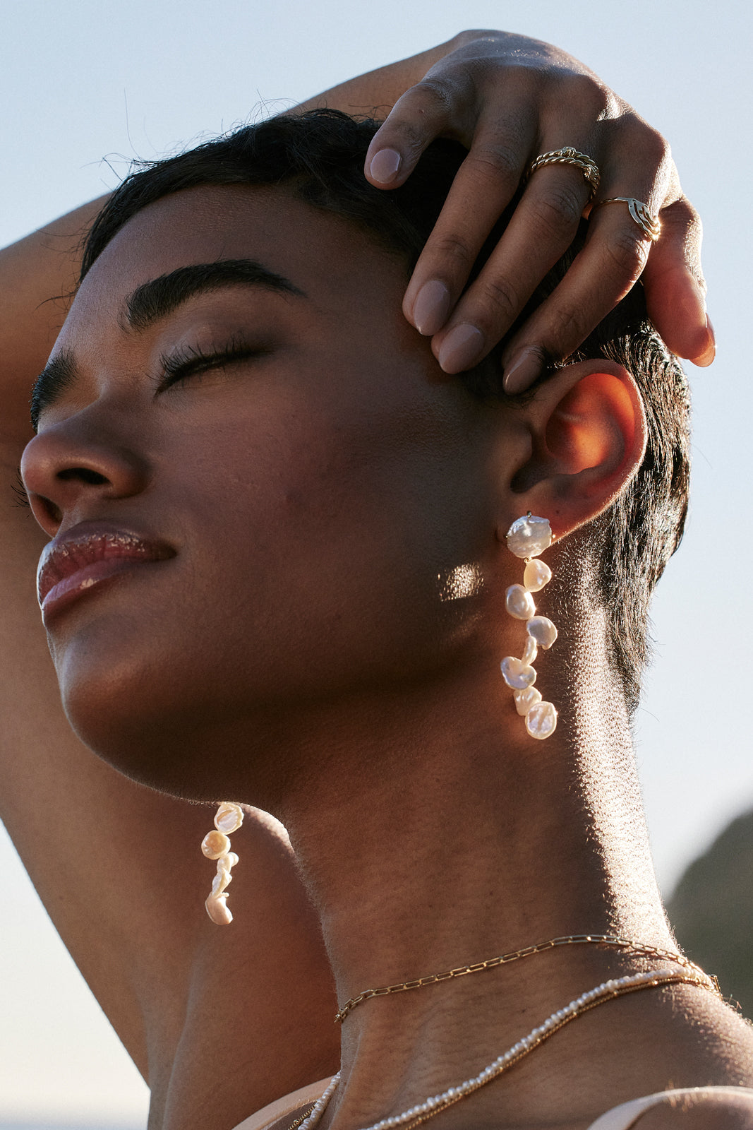 Close up on model wearing Bryan Anthonys grit earrings