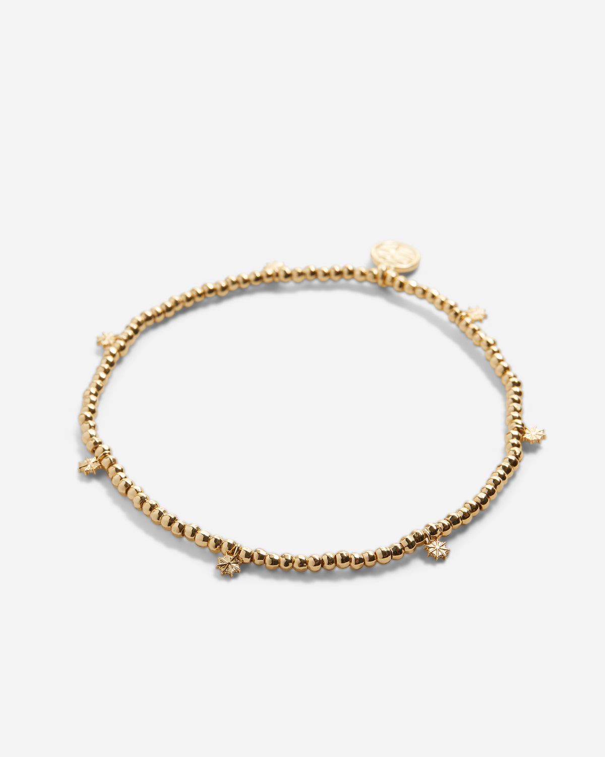 Close-up of Strength Beaded Icon Bracelet in 14k gold finish