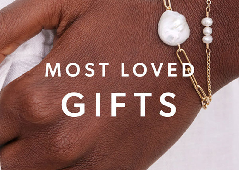 Most Love Gifts text with model hand on the background