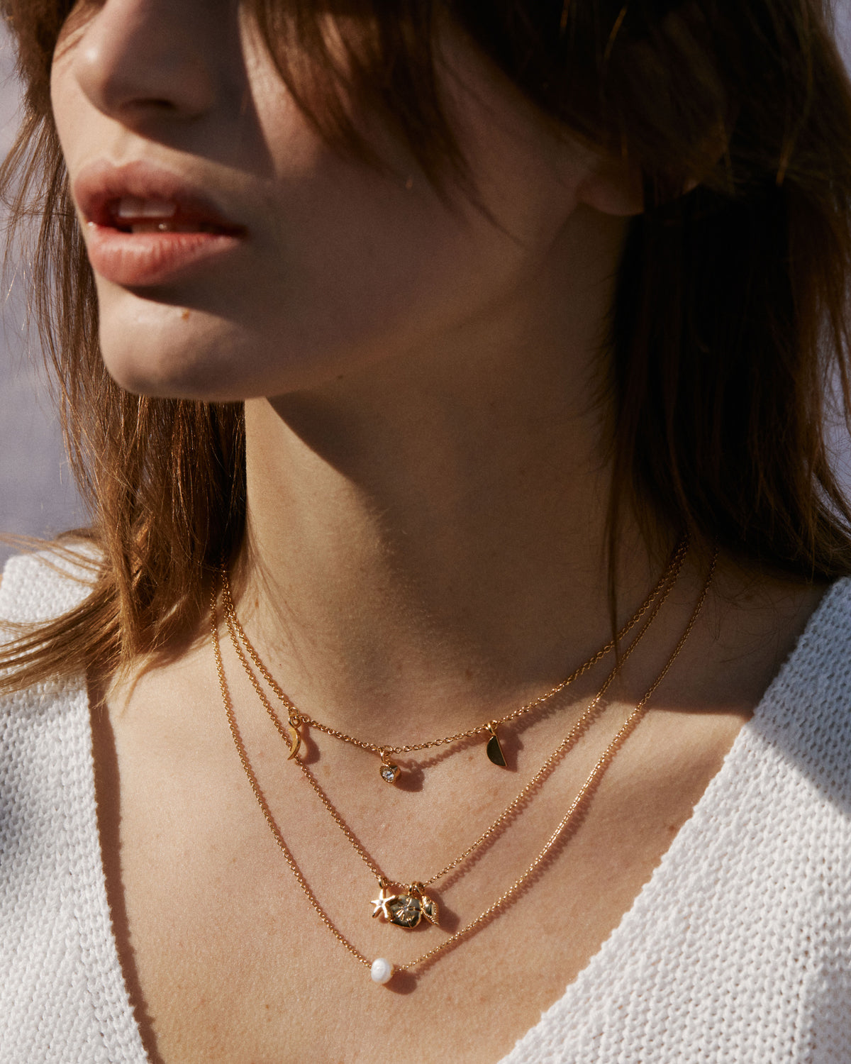 Bryan Anthonys Sea Seeker Gold Necklace with Crystal on model