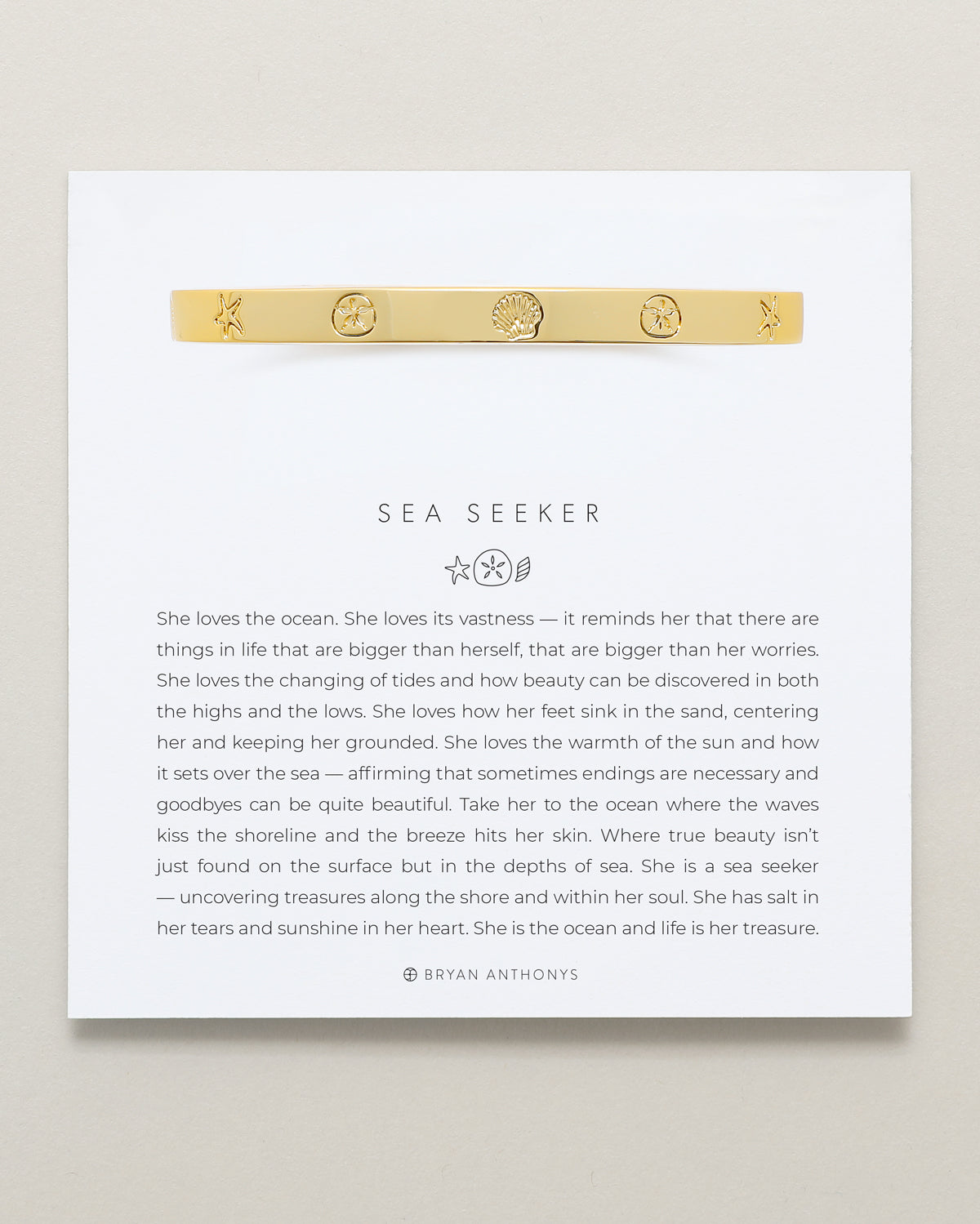 Bryan Anthonys Sea Seeker Gold Hinged Bracelet with sea shell engravings on card