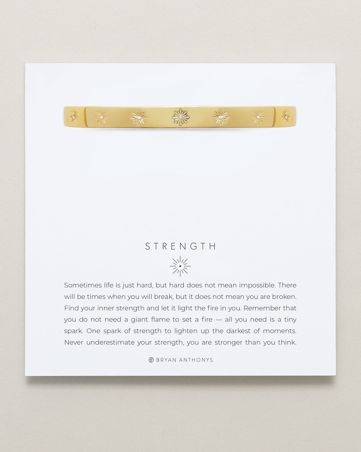 Bryan Anthonys Strength Gold Hinged Bracelet with Crystals on card