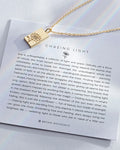 Chasing Light Necklace showcase in 14k gold on card