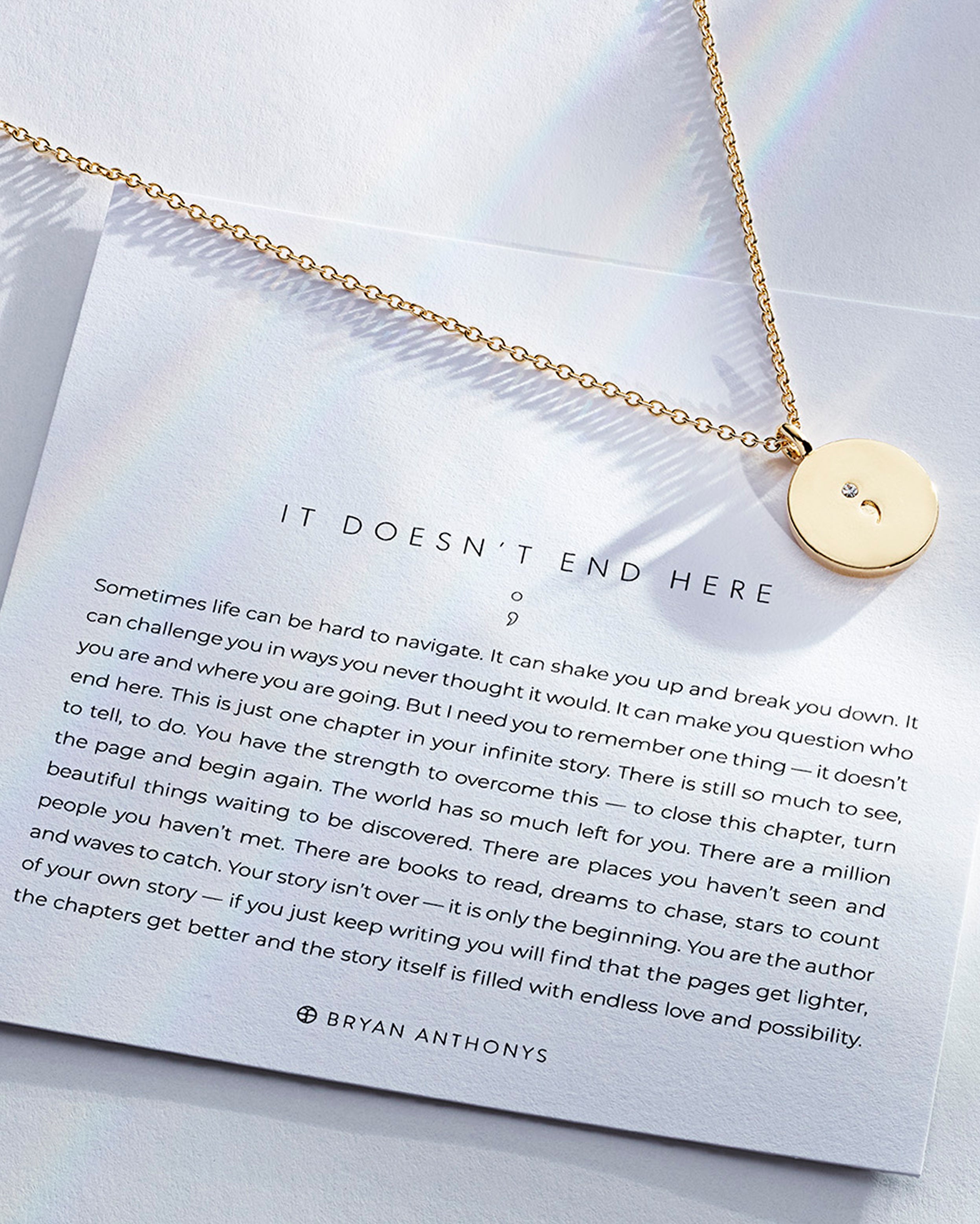It Doesn't End Here Necklace showcase in 14k gold on card