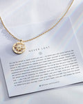 Never Lost Necklace showcase in 14k gold on card