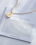 To the Moon and Back Necklace showcase in 14k gold on card
