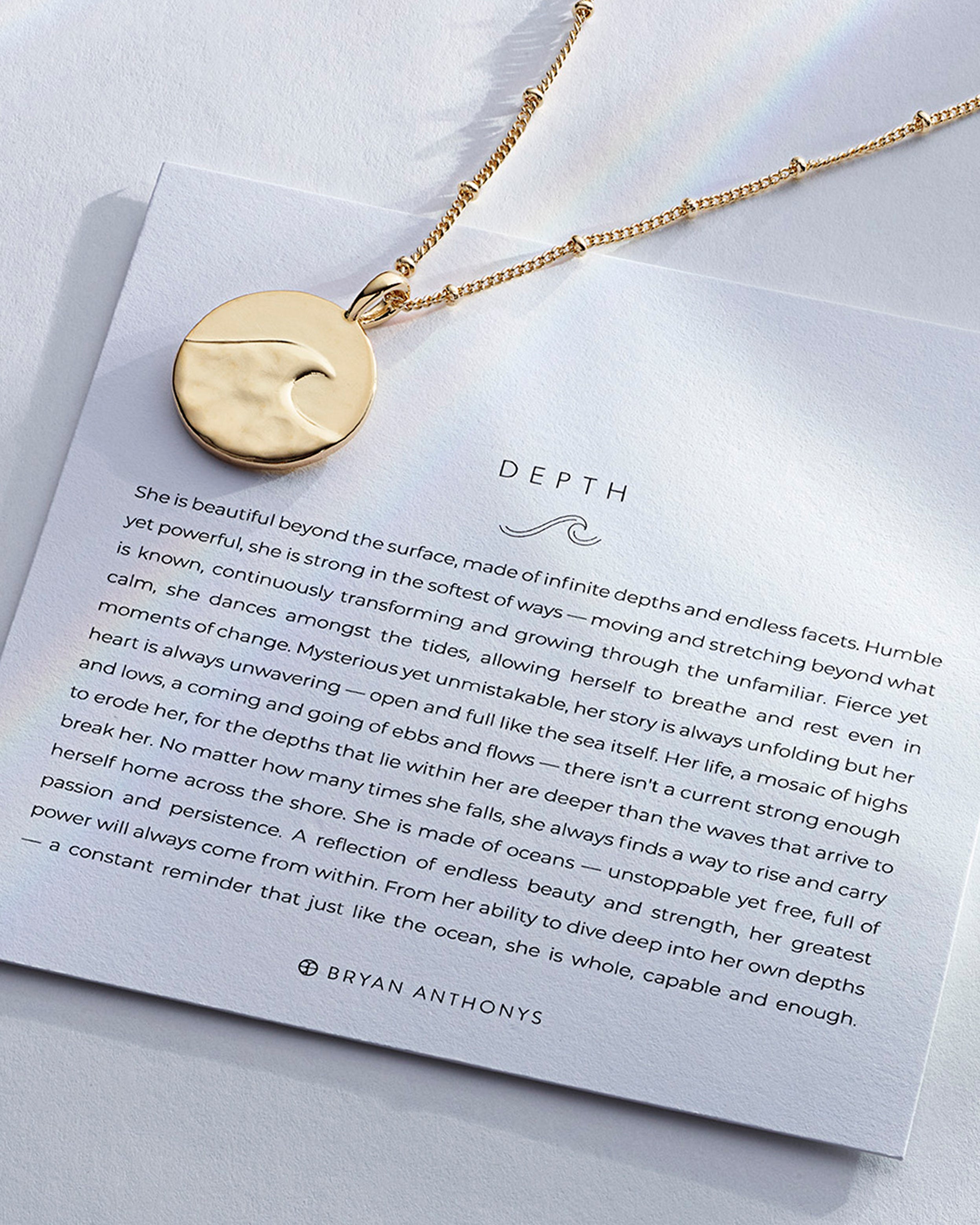 Depth Necklace showcase in 14k gold on card
