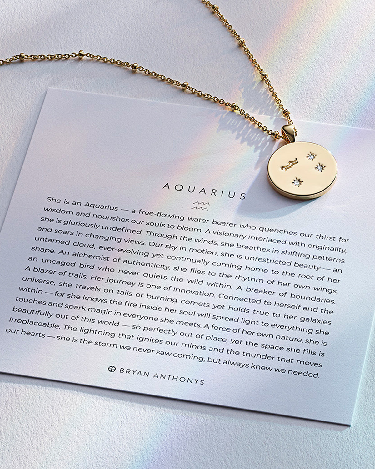 Bryan Anthonys Gold Aquarius Zodiac Necklace On Card